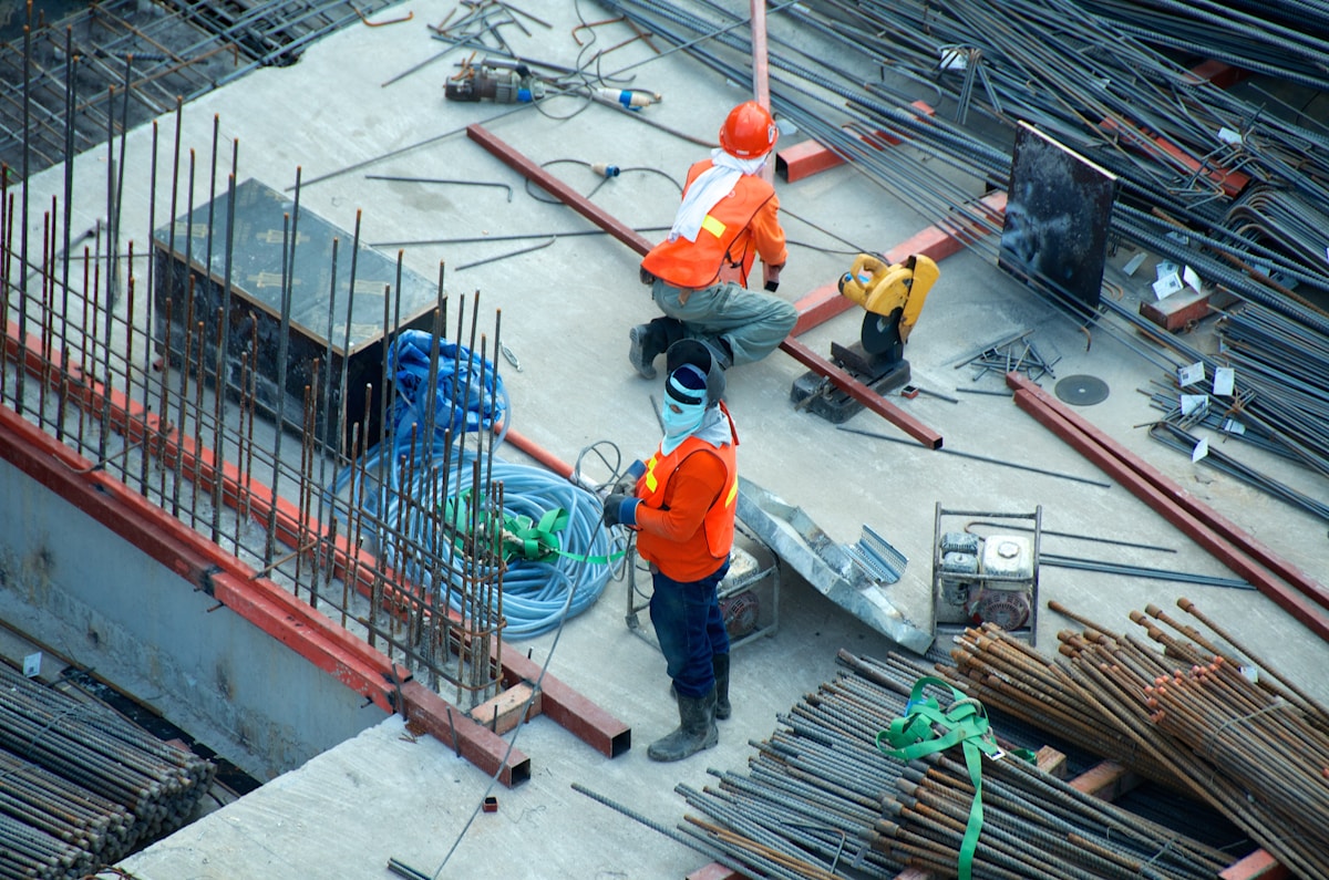 Construction professionals reviewing project plans on site